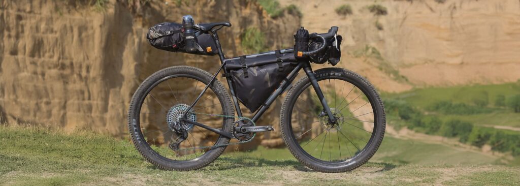 Close up of bicycle touring equipment mounted on a frame
