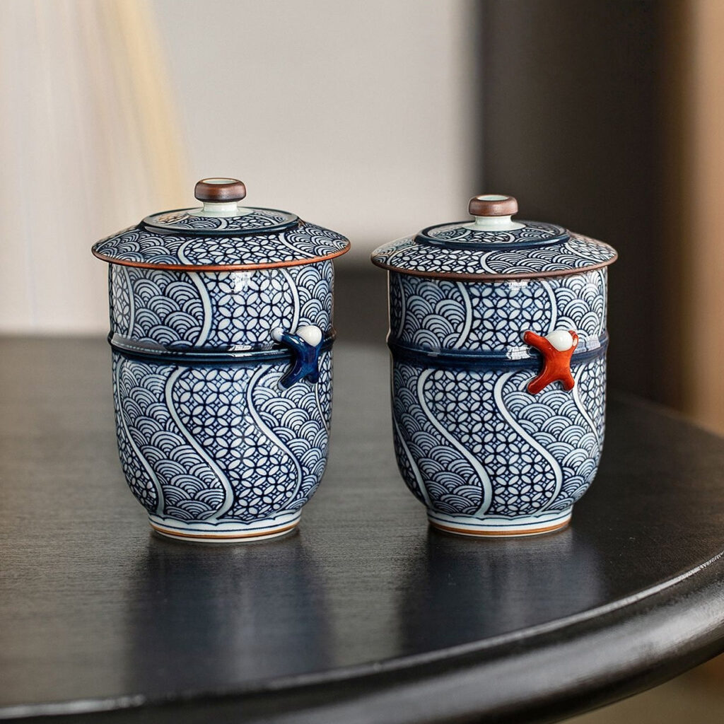 Close up of the intricate seigaiha wave and shippou geometric motifs on the lidded teacup