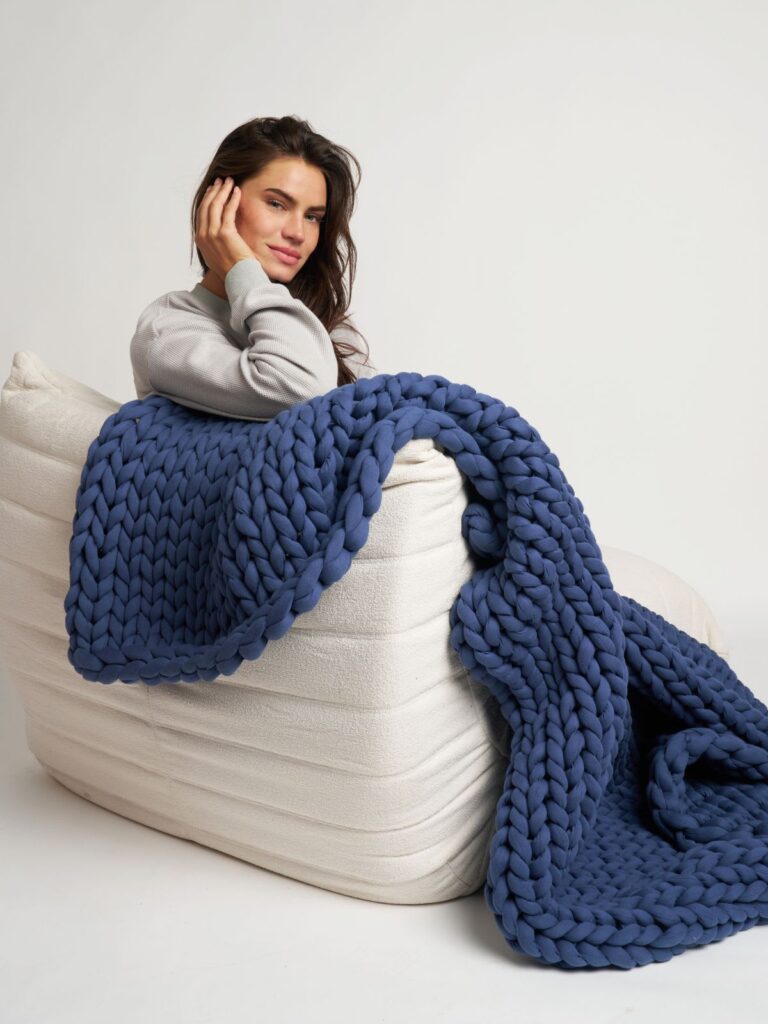 Close up view of breathable chunky knit weighted blanket showing open weave cotton structure