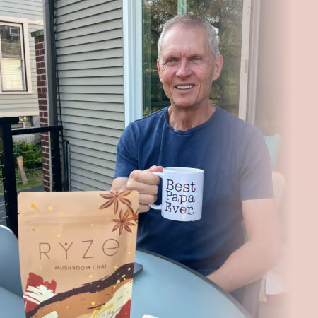 A steaming cup of RYZE Boosted Chai latte, ready to drink